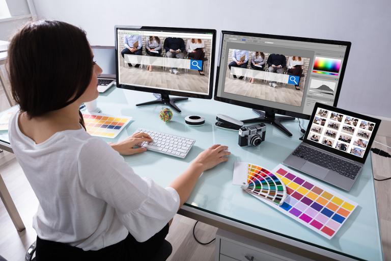 shutterstock_1042807015.jpg UI/UX Designer working on project