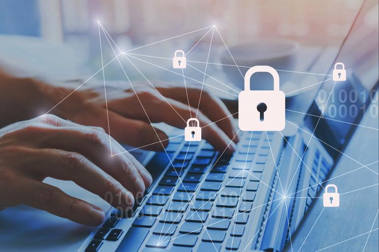 shutterstock_1202221816.jpg Cybersecurity expert working on a project